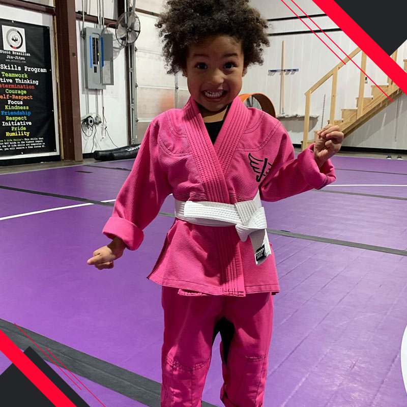 Stoic Brazilian Jiu JItsu Martial Arts Mansfield Texas Kids Class with student wearing a pink gi ready for her preschool-bjj class age 4 to 6